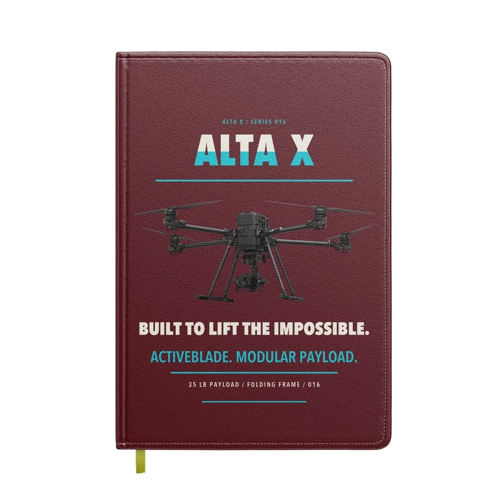 Freefly Alta X design on dark red notebook