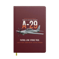 Thumbnail for A-29 Super Tucano Light Attack design on dark red notebook