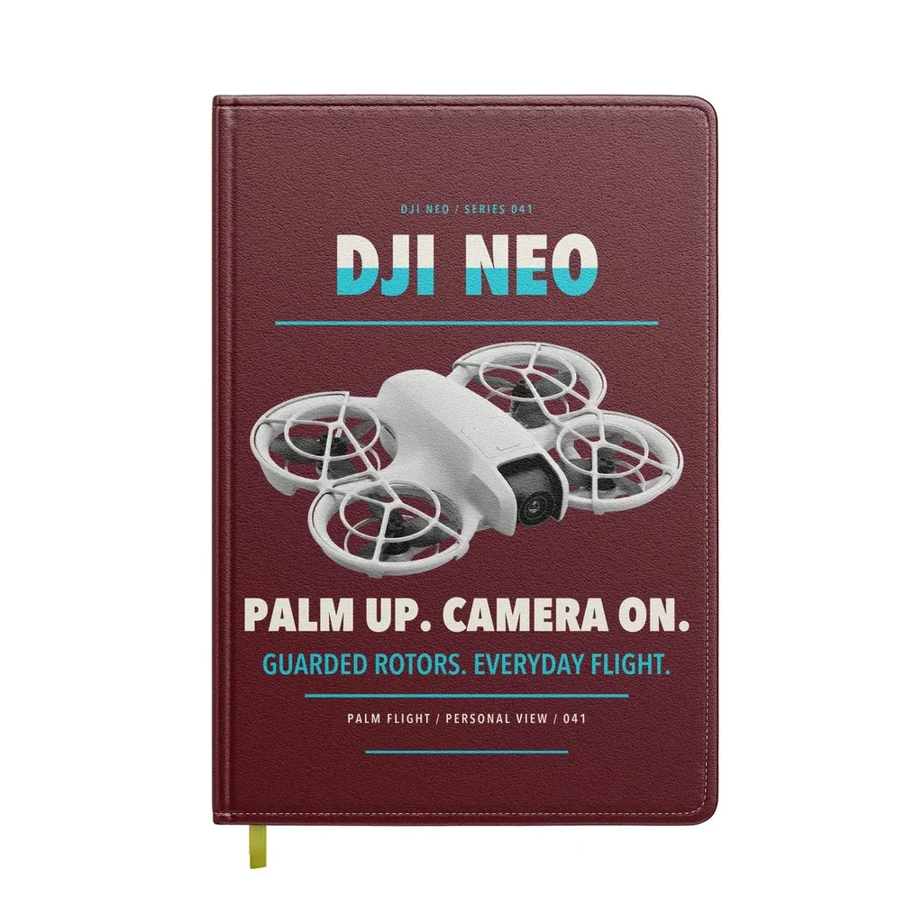 DJI Neo design on dark red notebook