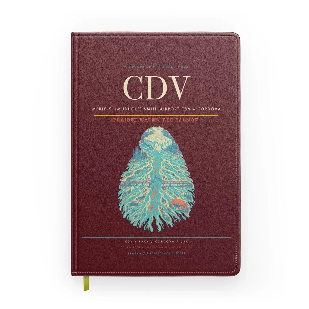 Merle K. (Mudhole) Smith Airport (CDV) design on dark red notebook