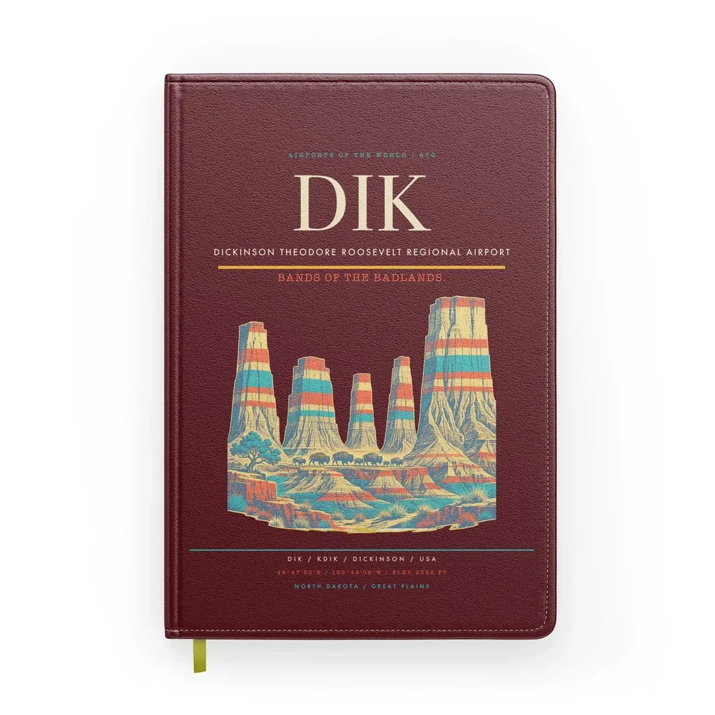 Dickinson Theodore Roosevelt Regional Airport (DIK) design on dark red notebook
