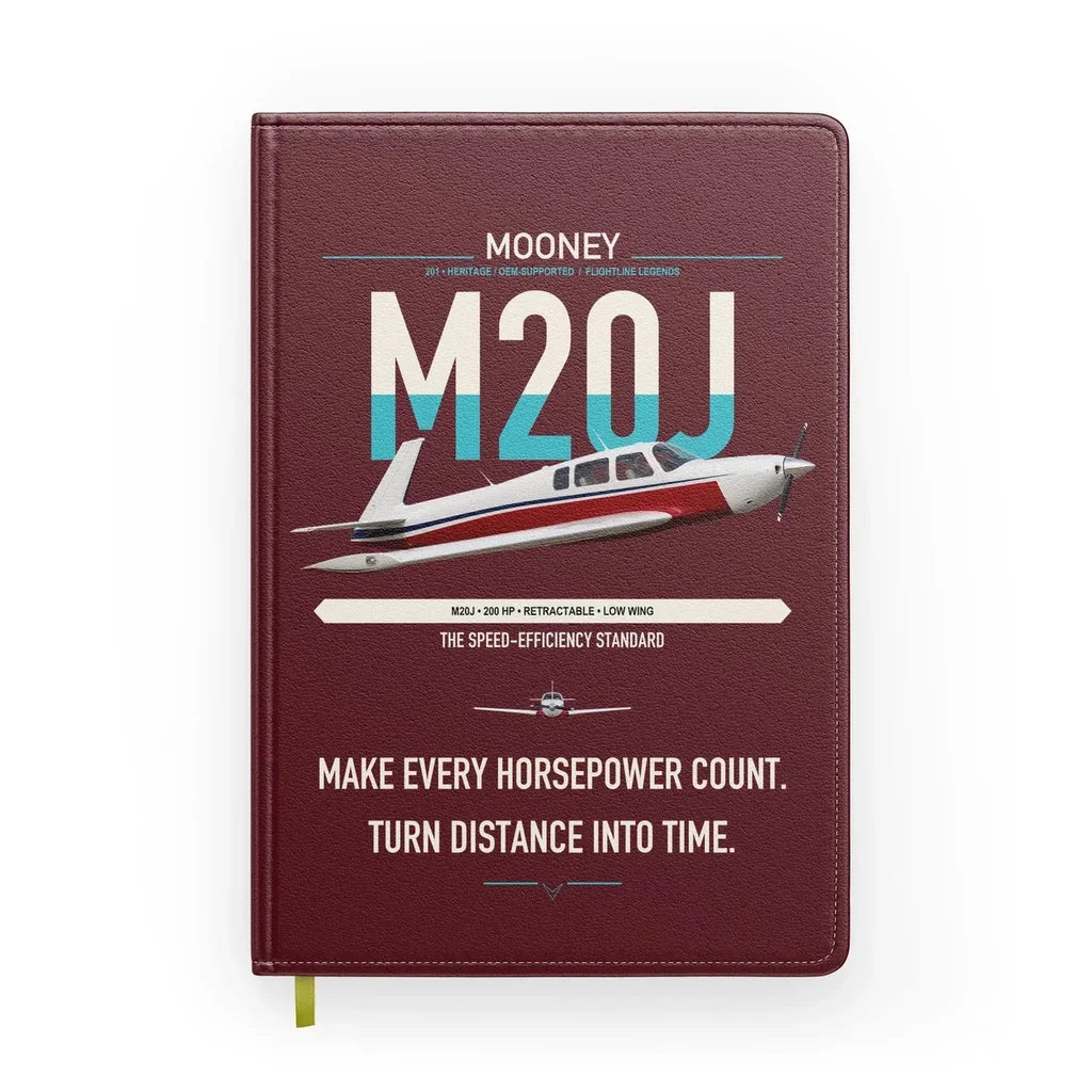 Mooney M20J 201 design on dark red notebook