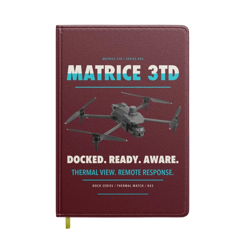 DJI Matrice 3TD design on dark red notebook