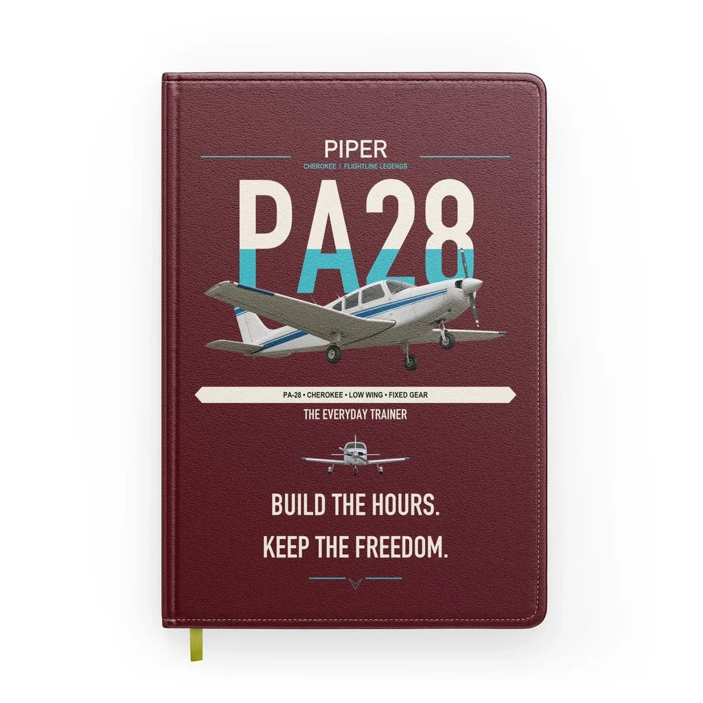 Piper PA-28 Cherokee design on dark red notebook