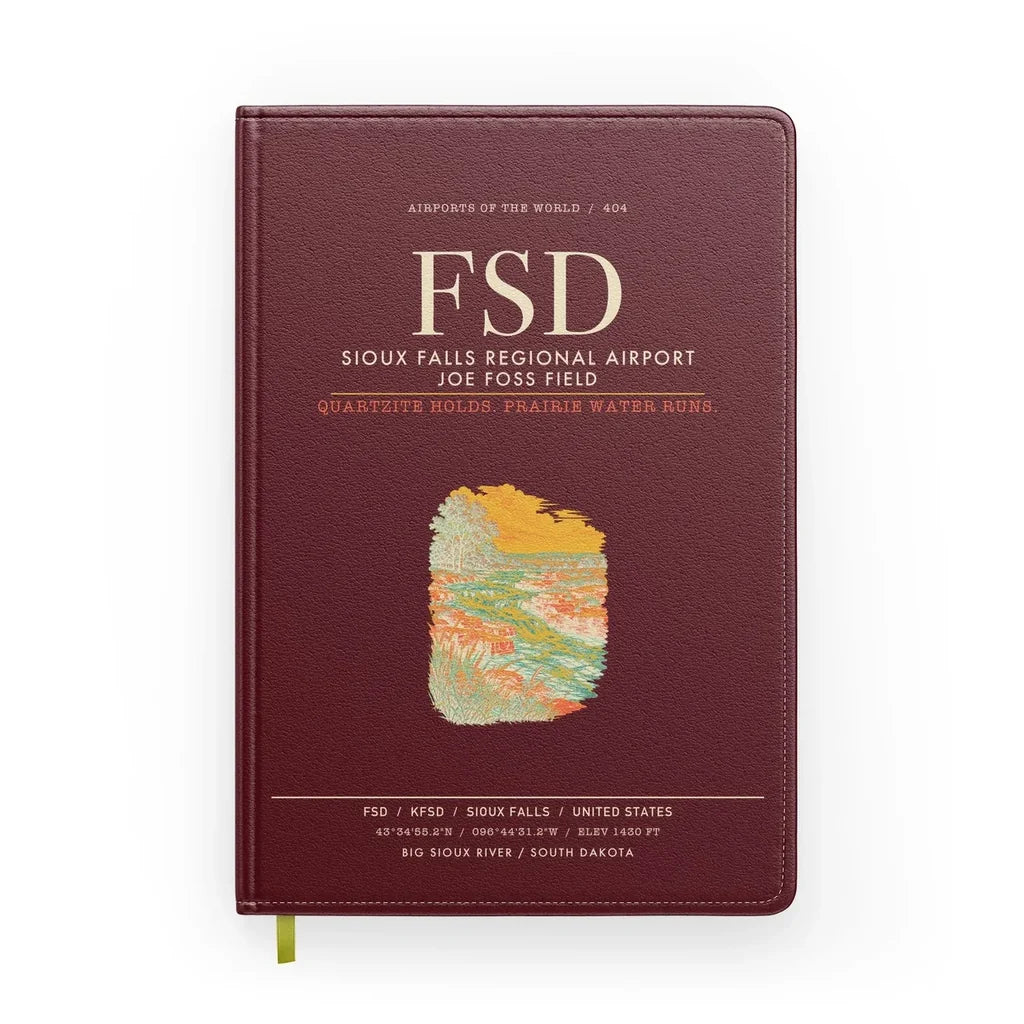 Sioux Falls Regional Airport Joe Foss Field (FSD) design on dark red notebook