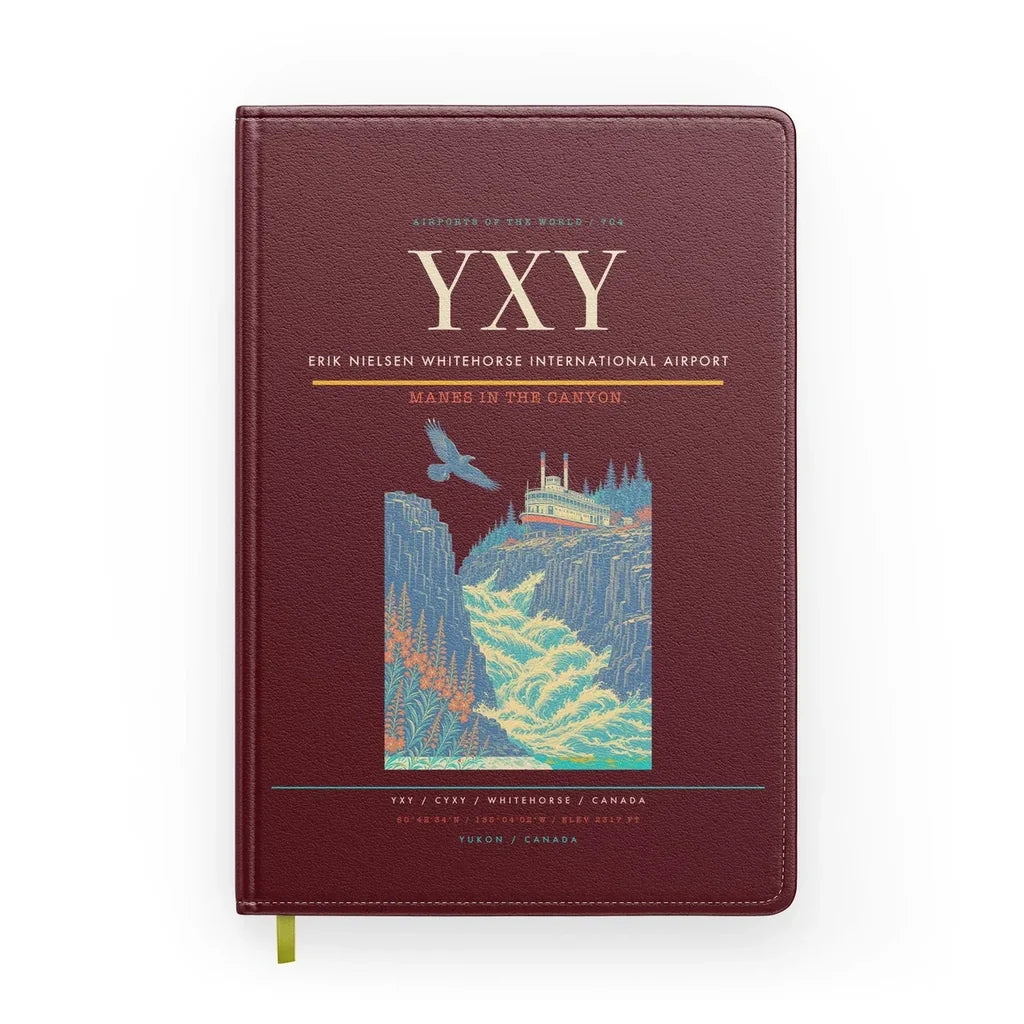 Erik Nielsen Whitehorse International Airport (YXY) design on dark red notebook