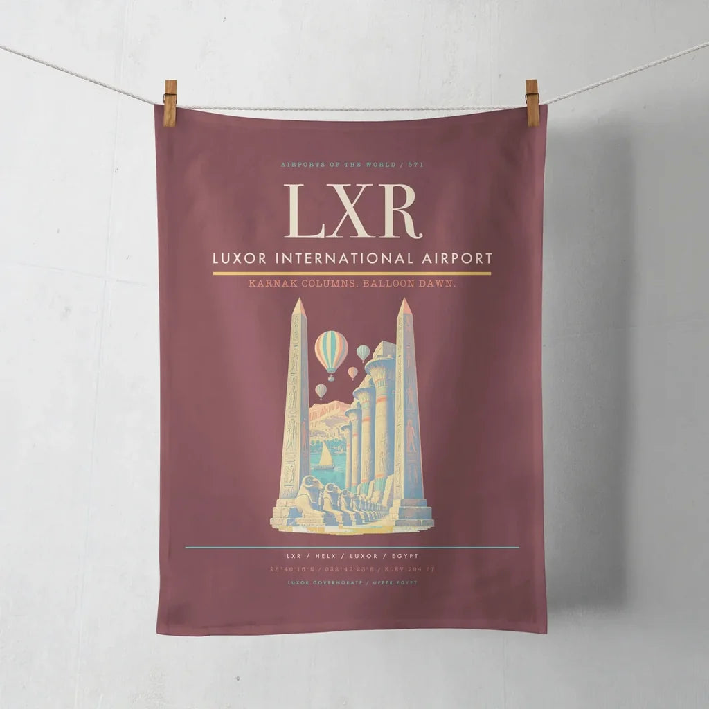 Luxor International Airport (LXR) design on dark red towel