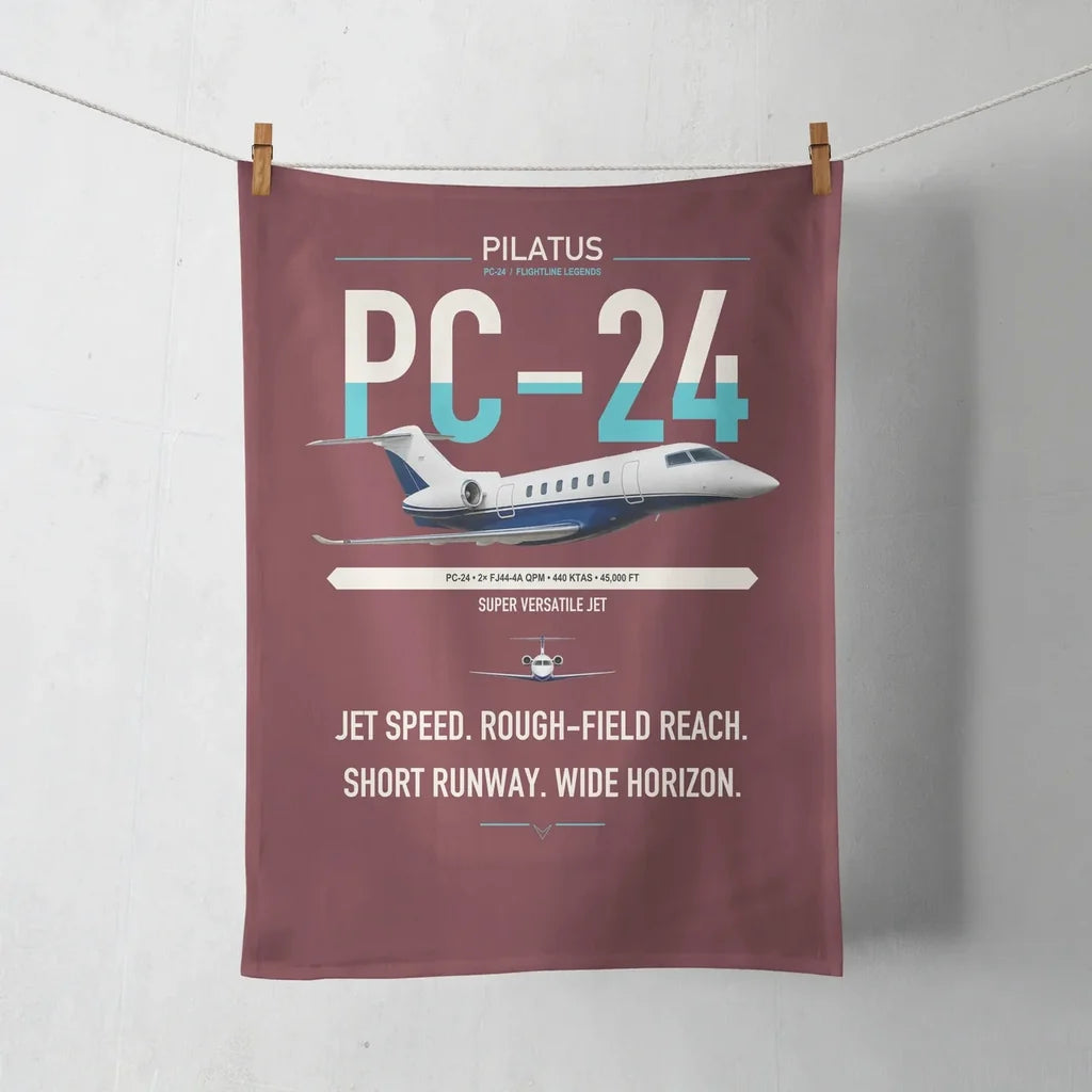 Pilatus PC-24 design on dark red towel