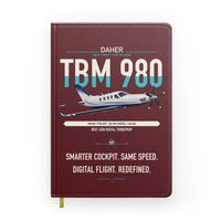 Thumbnail for Daher TBM 980 design on dark red notebook