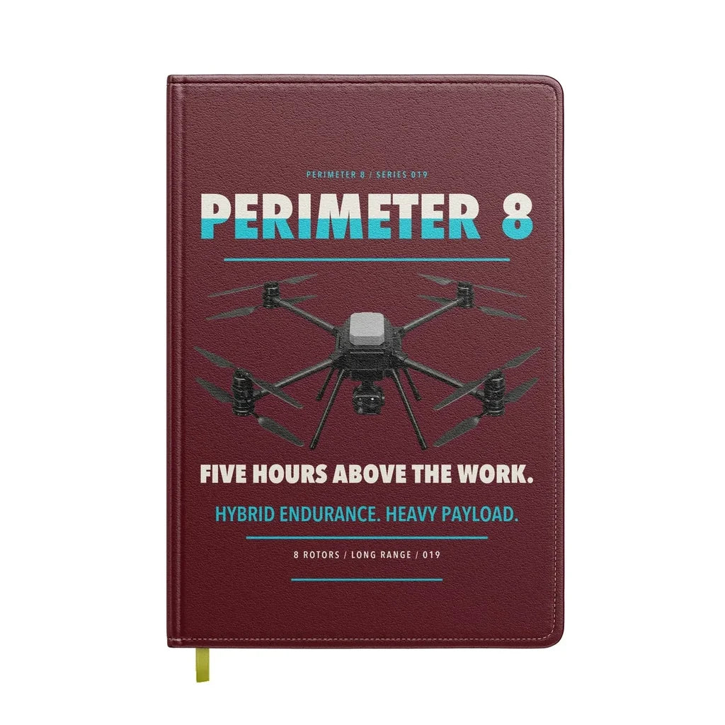 Skyfront Perimeter 8 design on dark red notebook