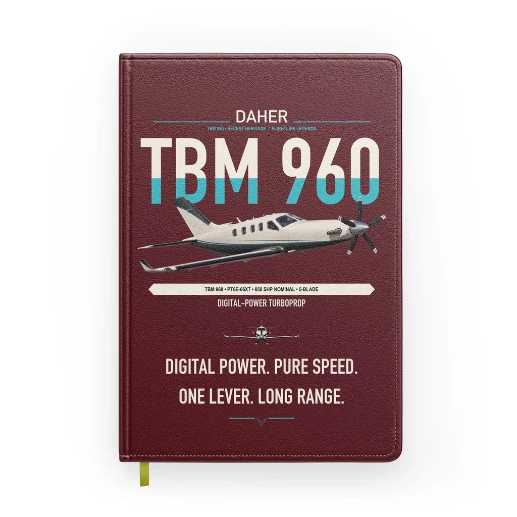Daher TBM 960 design on dark red notebook