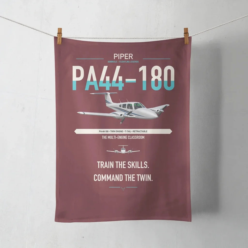 Piper PA-44-180 Seminole design on dark red towel