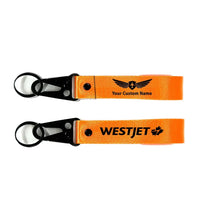 Thumbnail for WestJet Airlines Hawk-shaped key chain, Orange+ NAME