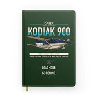 Thumbnail for Daher Kodiak 900 design on dark green notebook