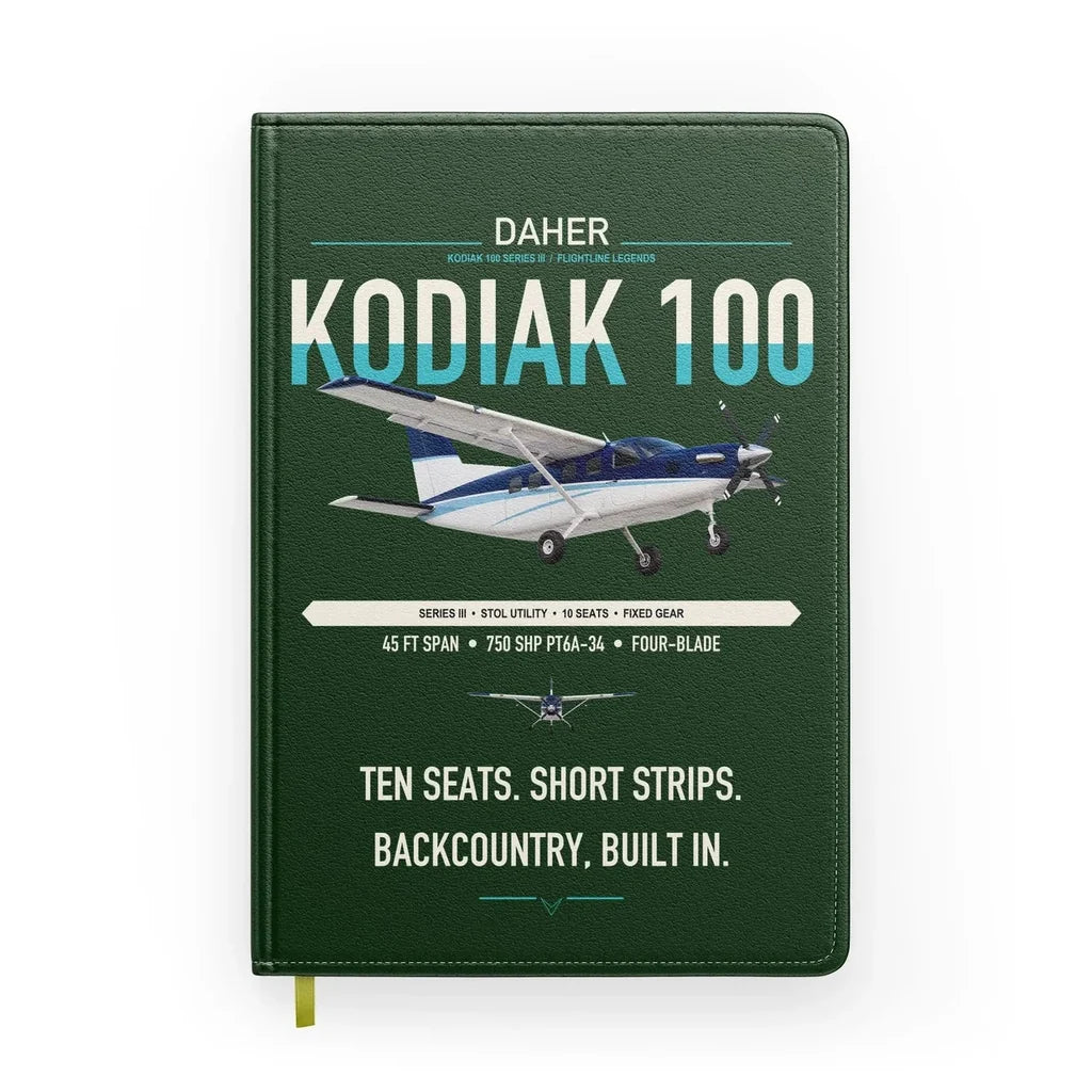 Daher Kodiak 100 Series III design on dark green notebook