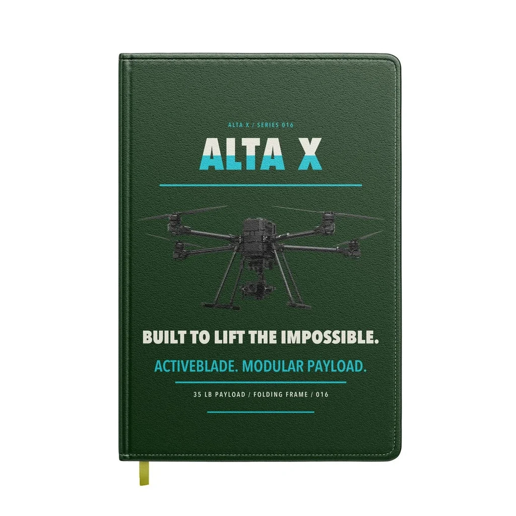 Freefly Alta X design on dark green notebook
