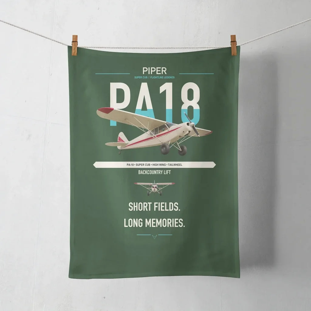 Piper PA-18 Super Cub design on dark green towel
