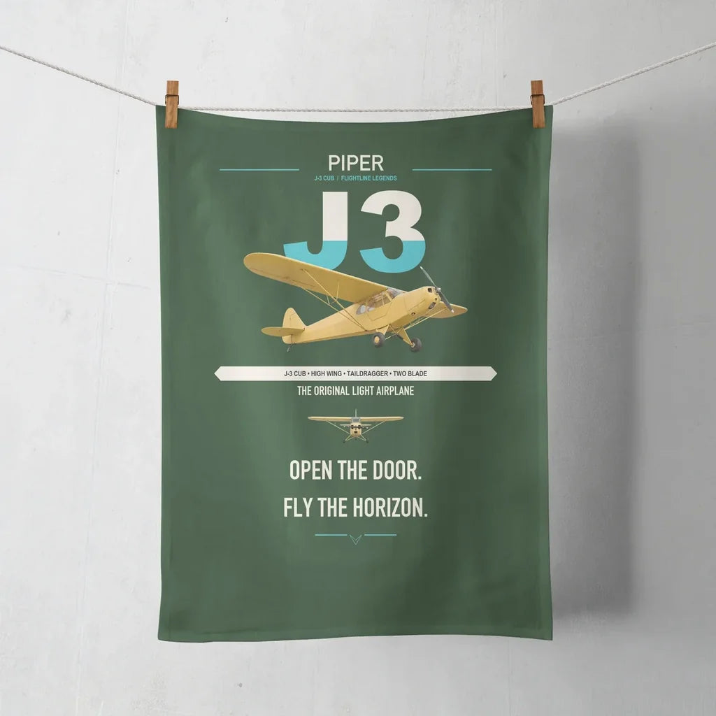 Piper J-3 Cub design on dark green towel