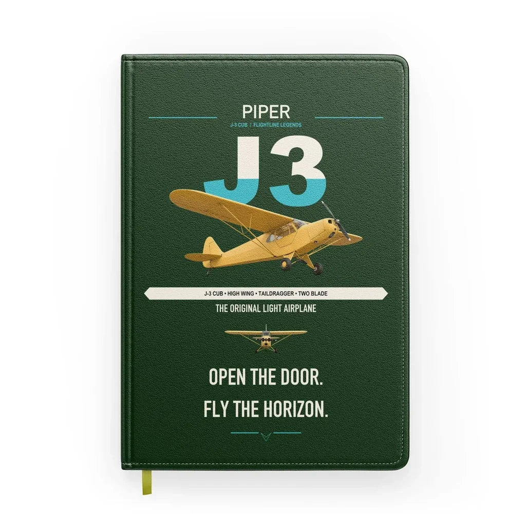 Piper J-3 Cub design on dark green notebook