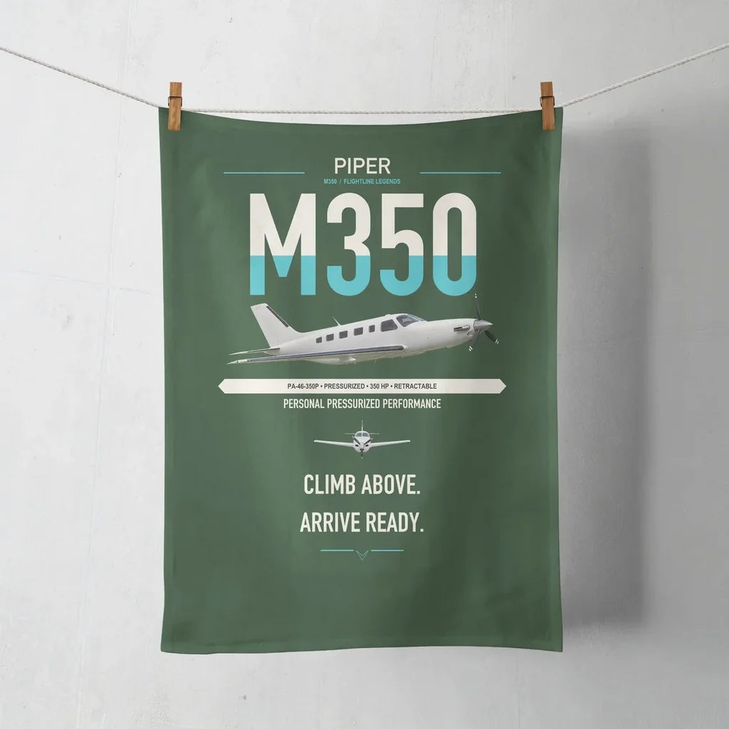 Piper M350 design on dark green towel