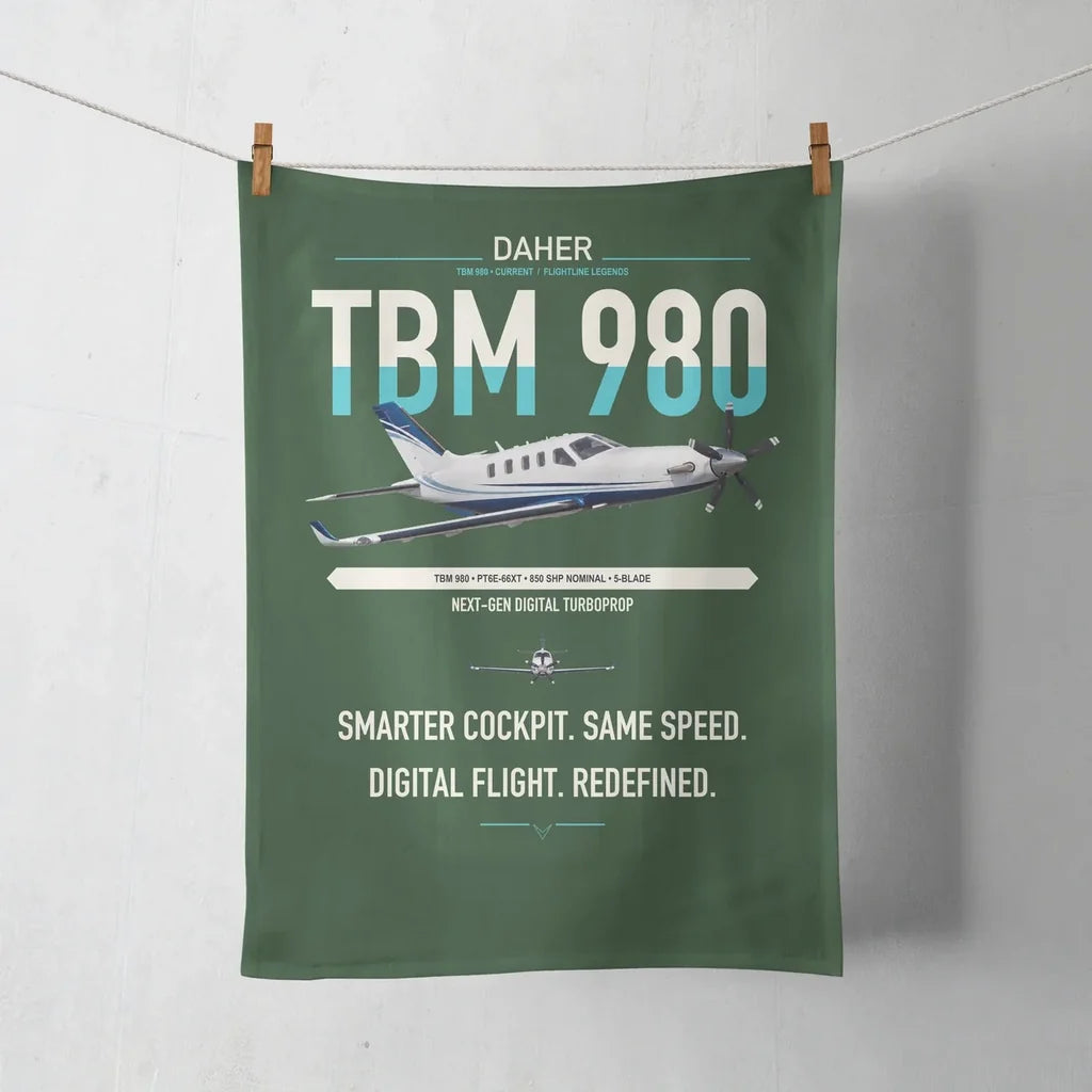 Daher TBM 980 design on dark green towel