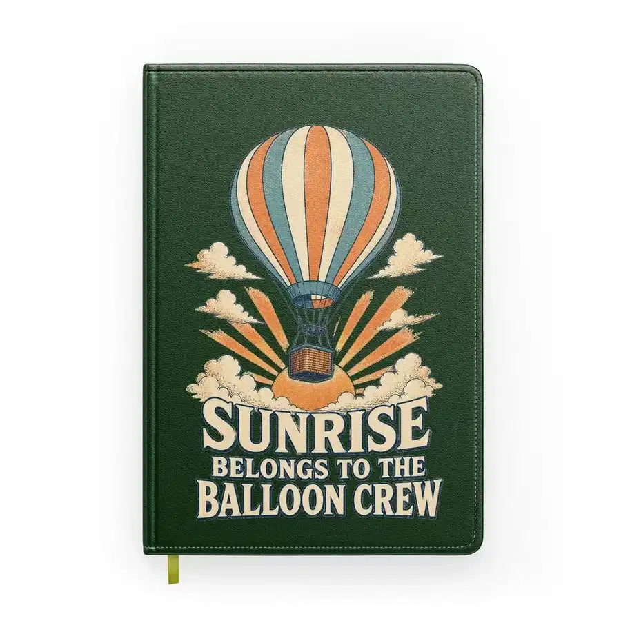 Sunrise Belongs To The Balloon Crew design on dark green notebook