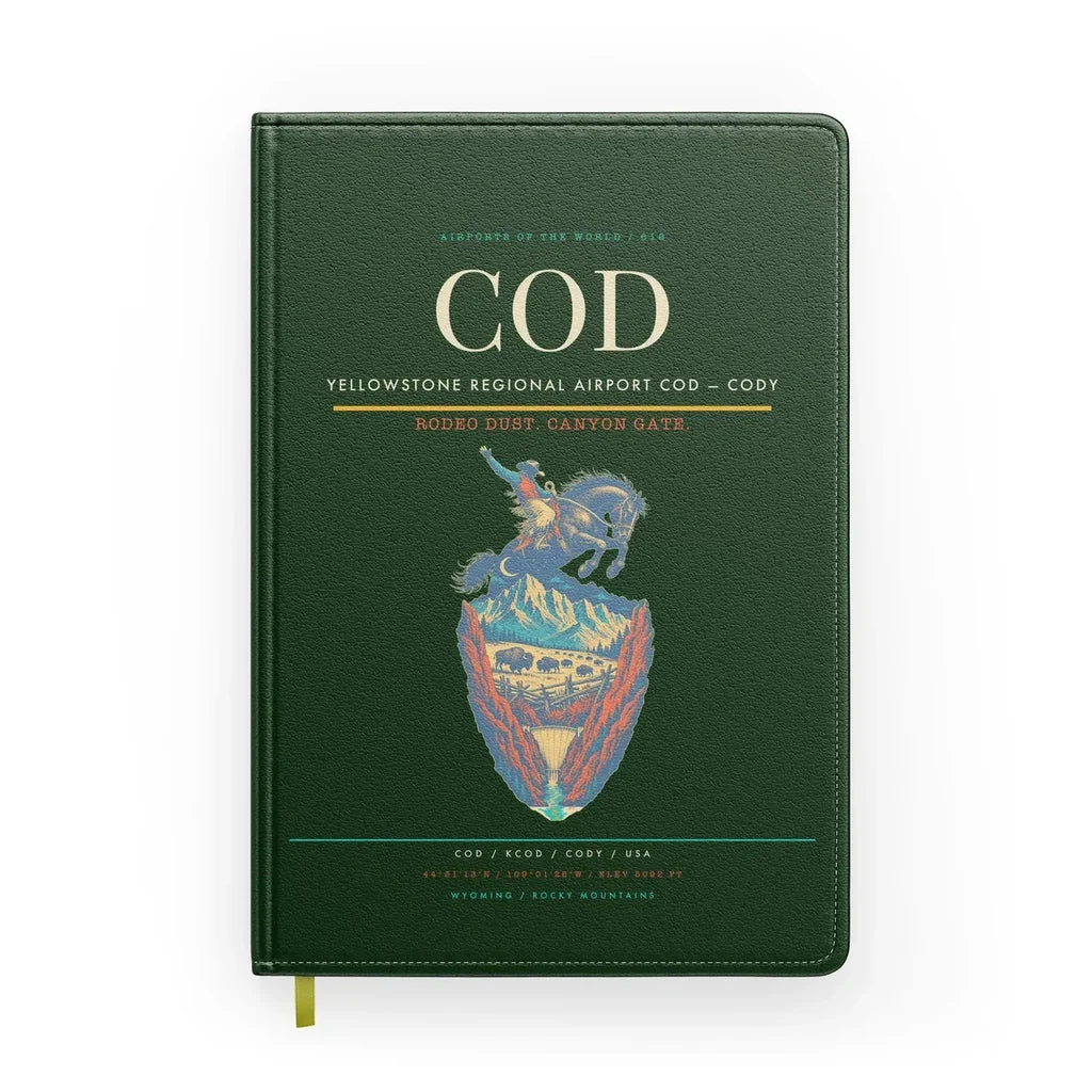 Yellowstone Regional Airport (COD) design on dark green notebook