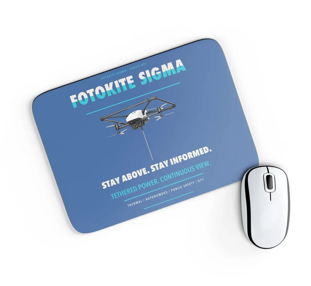 Fotokite Sigma design on blue rectangle mouse pad