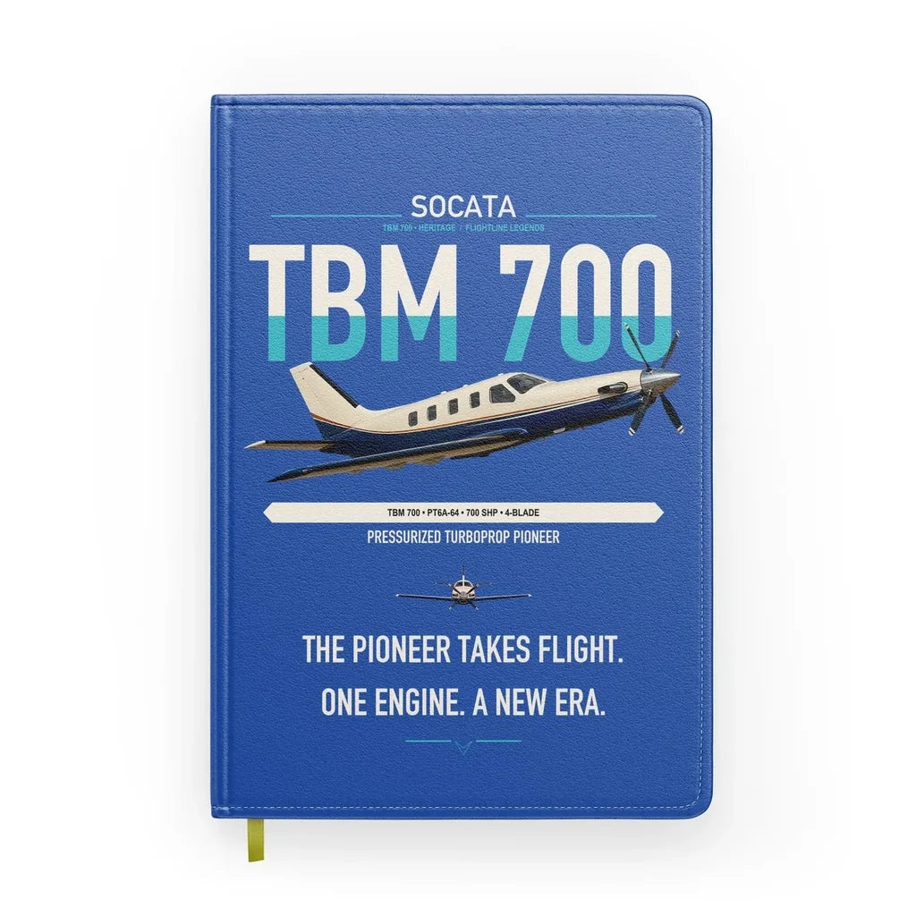 Socata TBM 700 design on blue notebook