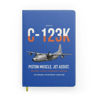 Thumbnail for C-123K Provider design on blue notebook