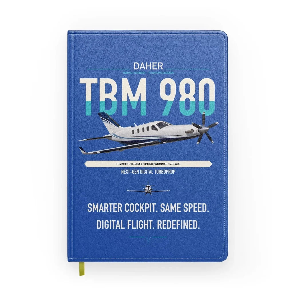Daher TBM 980 design on blue notebook