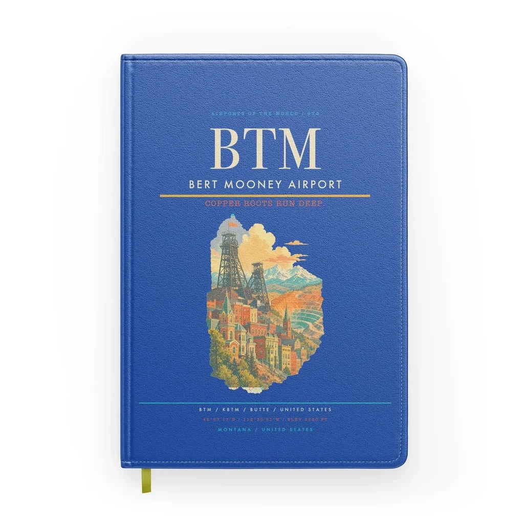 Bert Mooney Airport (BTM) design on blue notebook