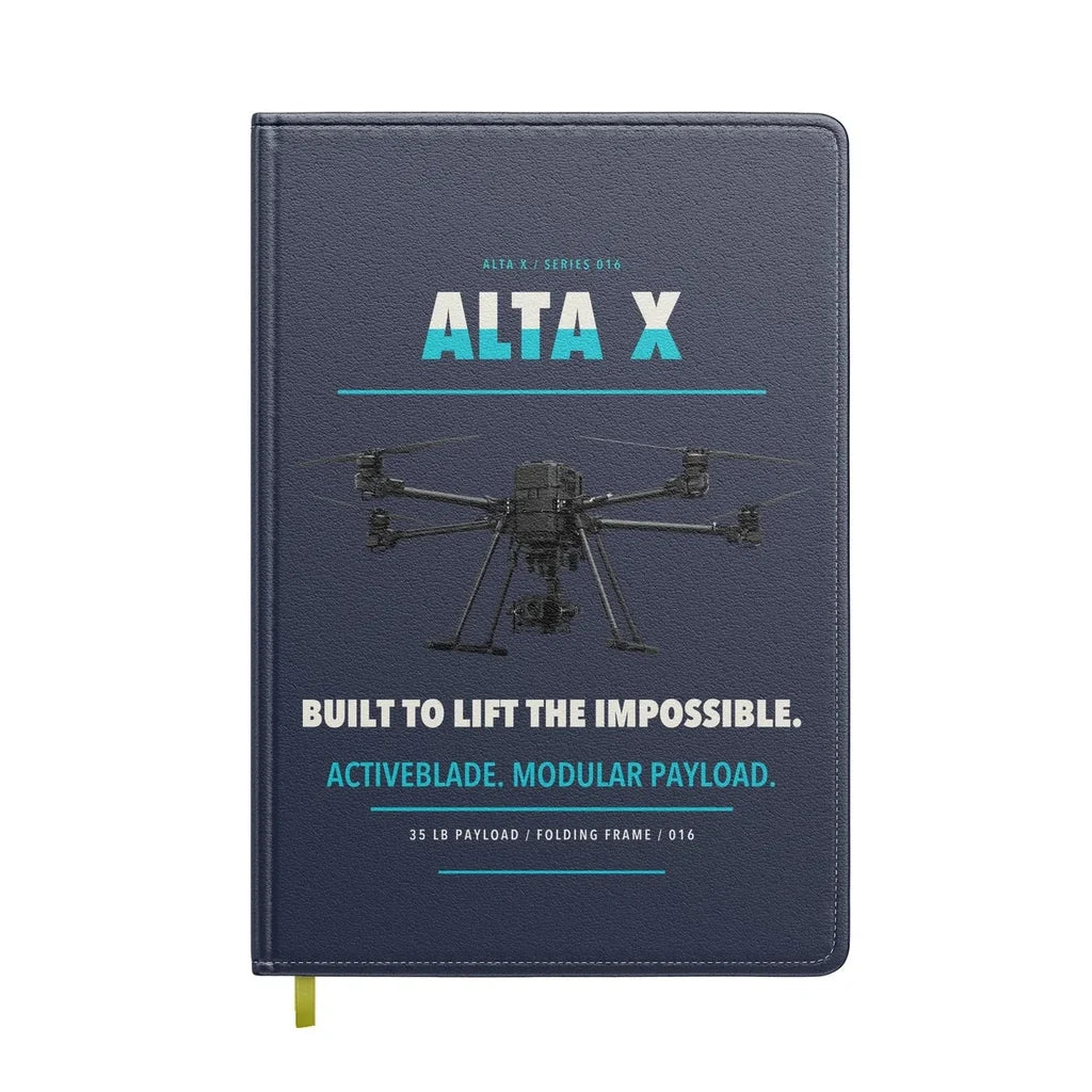 Freefly Alta X design on navy blue notebook