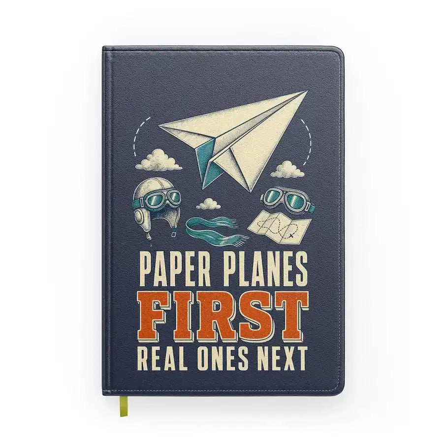 Paper Planes First Real Ones Next design on navy blue notebook