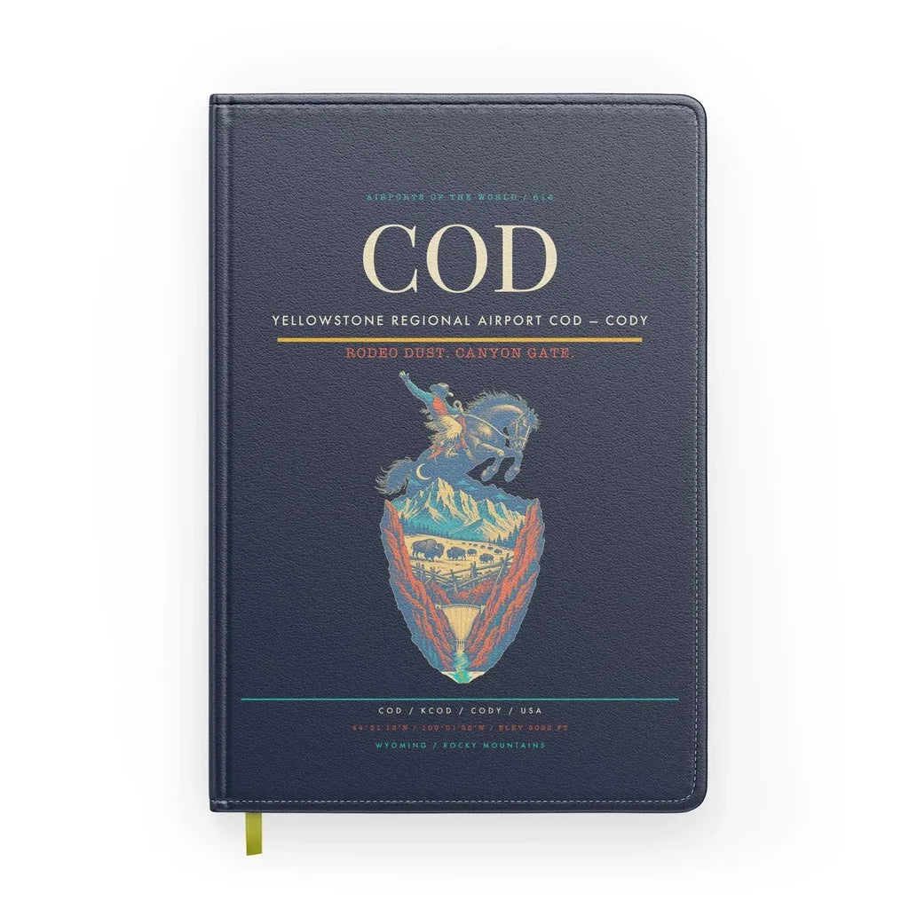 Yellowstone Regional Airport (COD) design on navy blue notebook