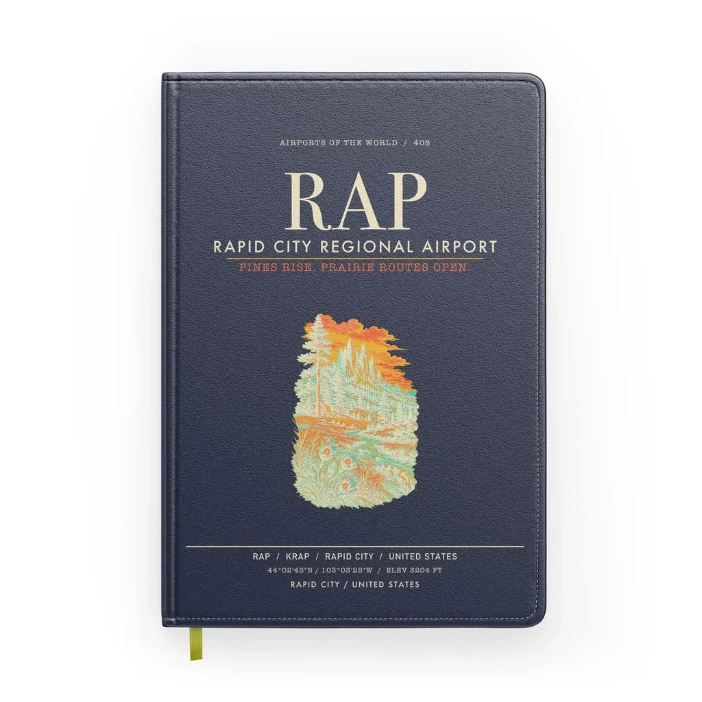 Rapid City Regional Airport (RAP) design on navy blue notebook
