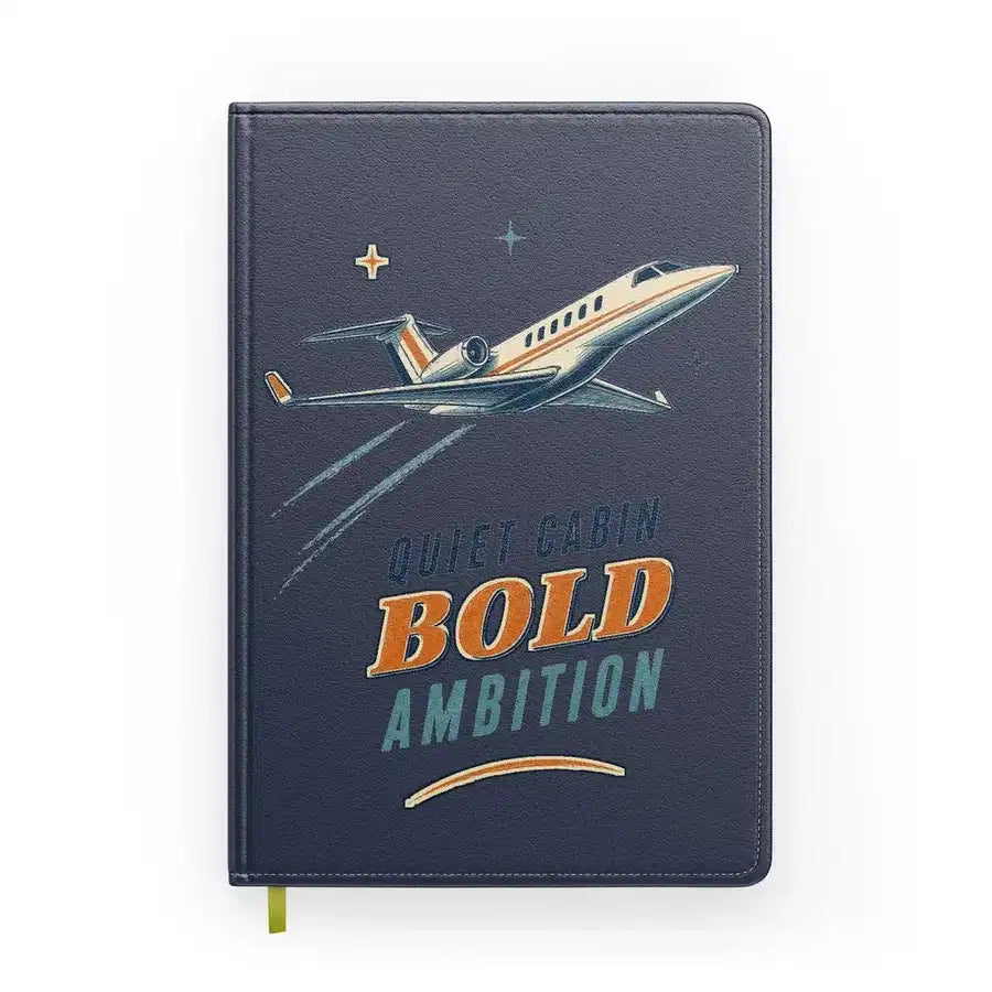 Quiet Cabin Bold Ambition design on navy blue notebook