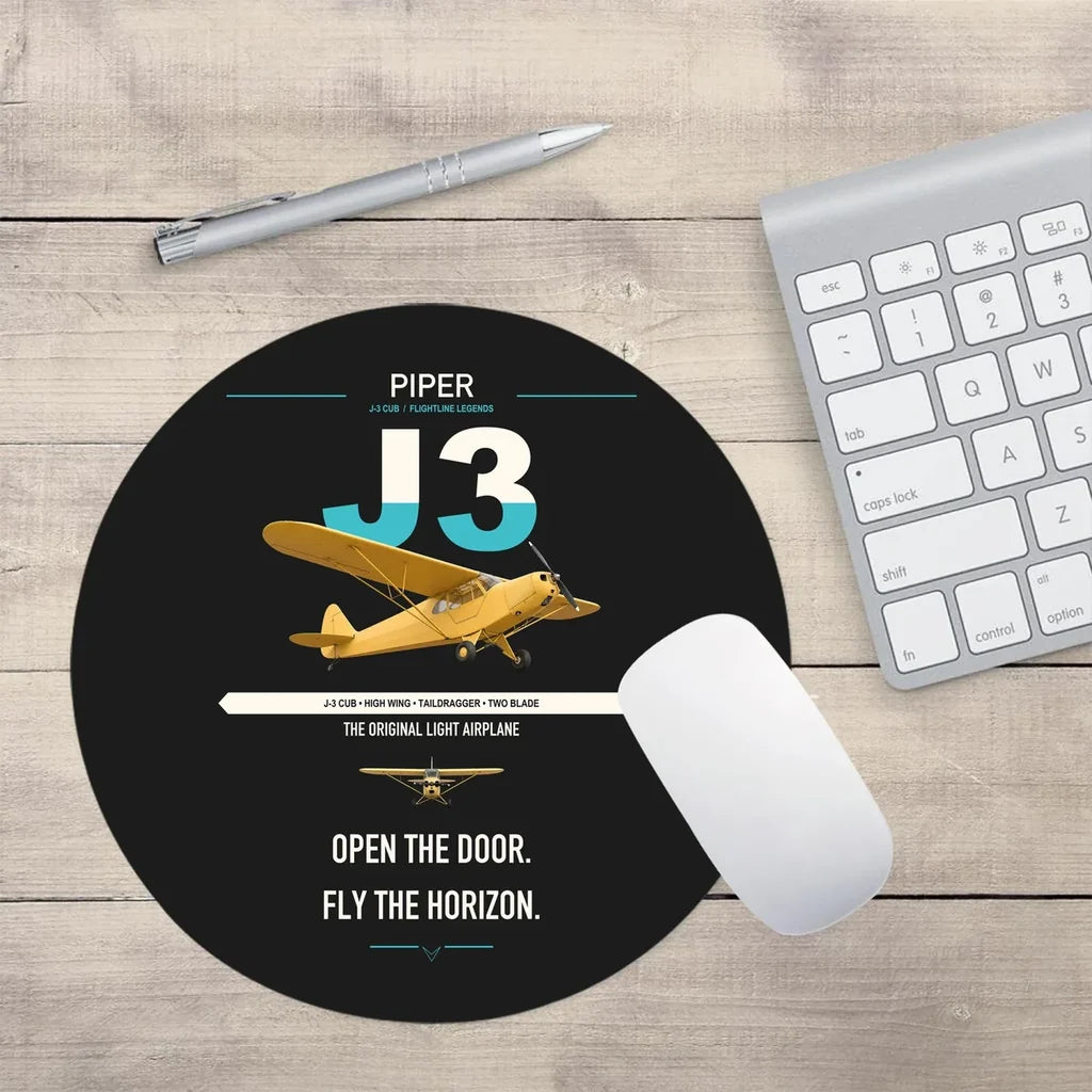 Piper J-3 Cub design on black round mouse pad