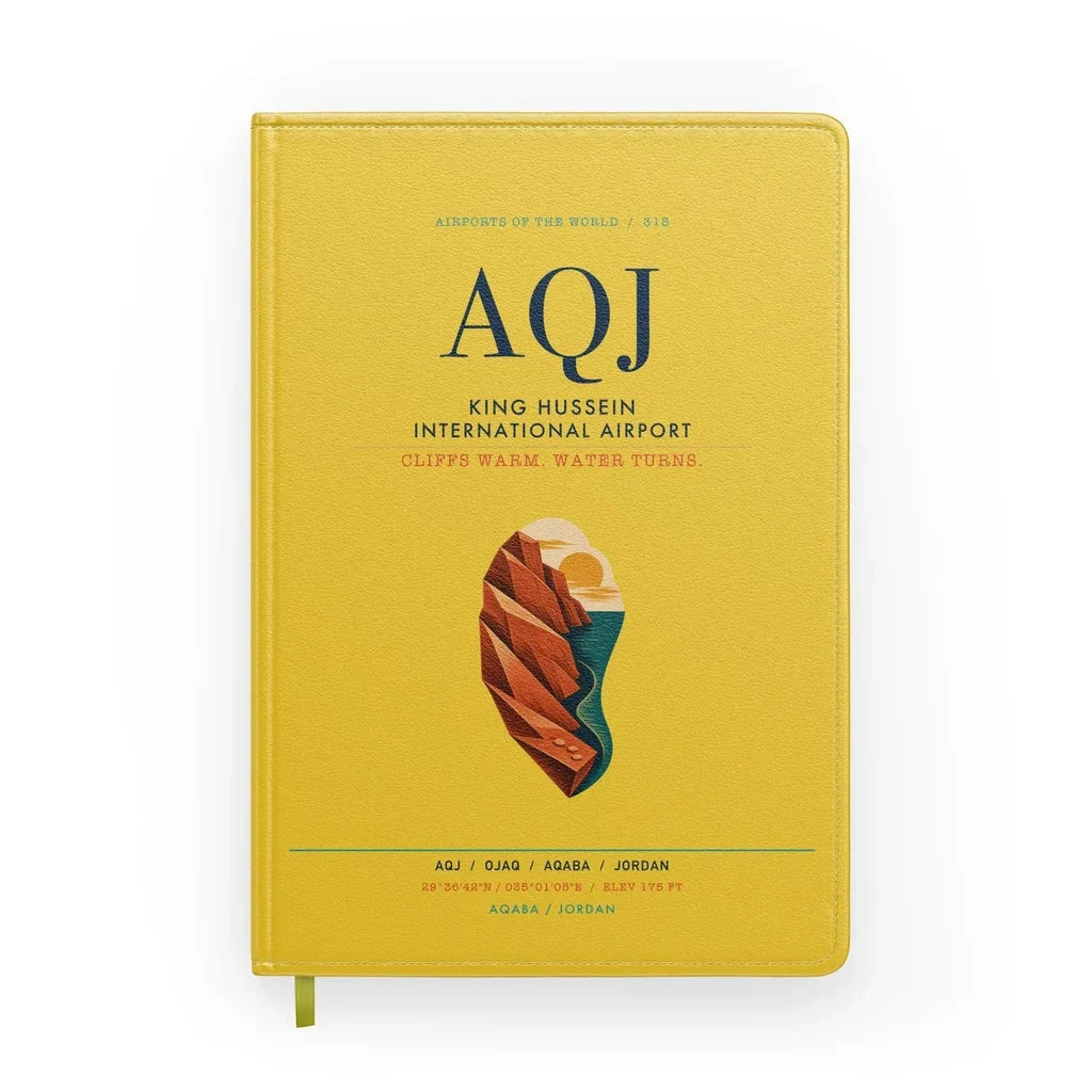 King Hussein International Airport (AQJ) design on yellow notebook