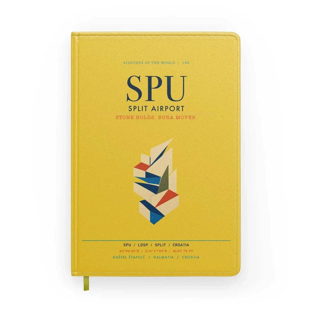 Split Airport (SPU) design on yellow notebook