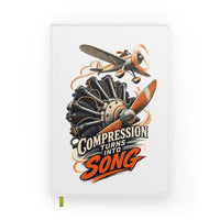 Thumbnail for Compression Turns Into Song design on white notebook