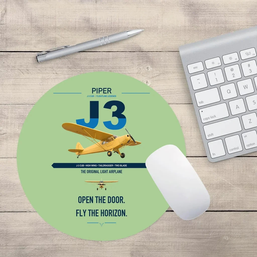 Piper J-3 Cub design on light green round mouse pad