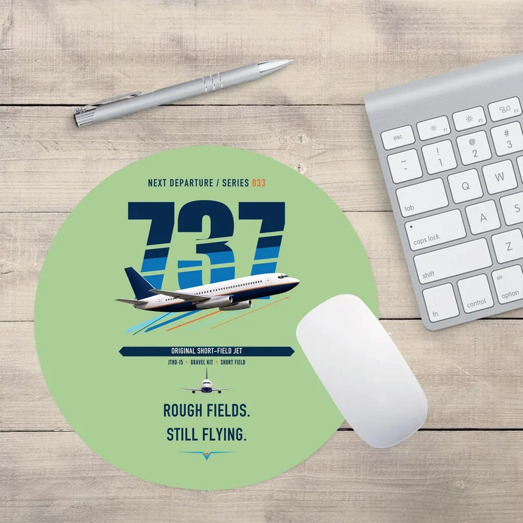 Boeing 737-200 design on light green round mouse pad