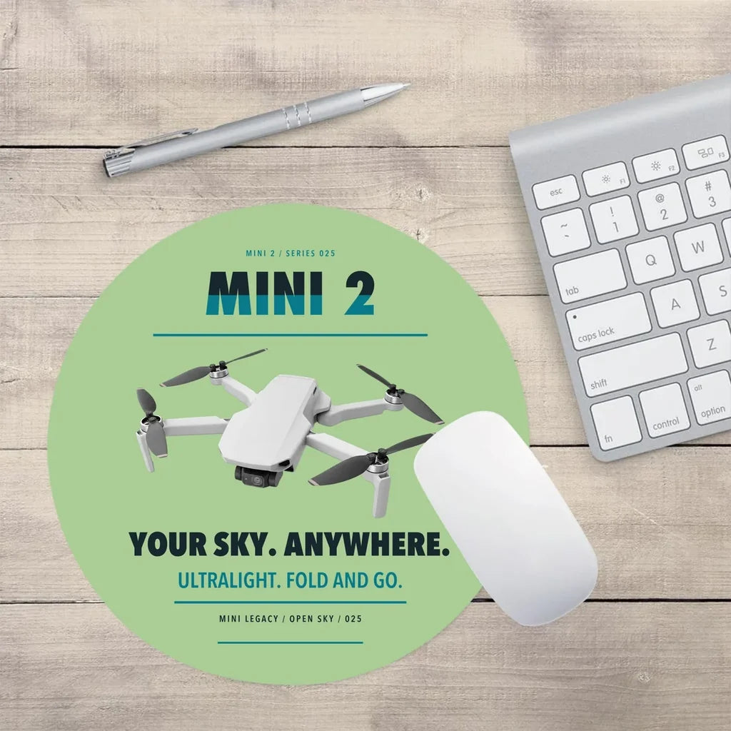 DJI Mini 2 design on light green round mouse pad