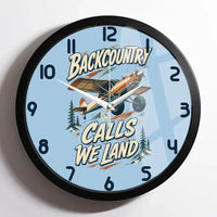Thumbnail for Backcountry Calls We Land design on light blue framed wall clock