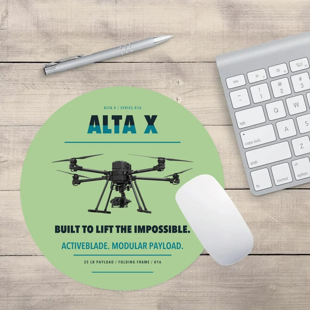 Freefly Alta X design on light green round mouse pad