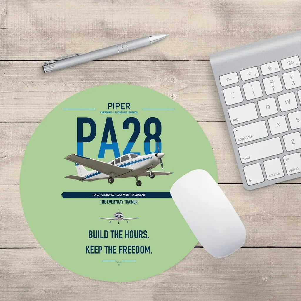 Piper PA-28 Cherokee design on light green round mouse pad