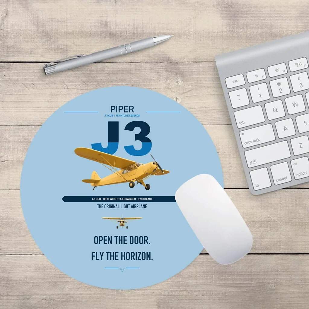 Piper J-3 Cub design on light blue round mouse pad