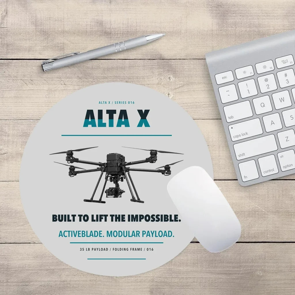 Freefly Alta X design on light gray round mouse pad