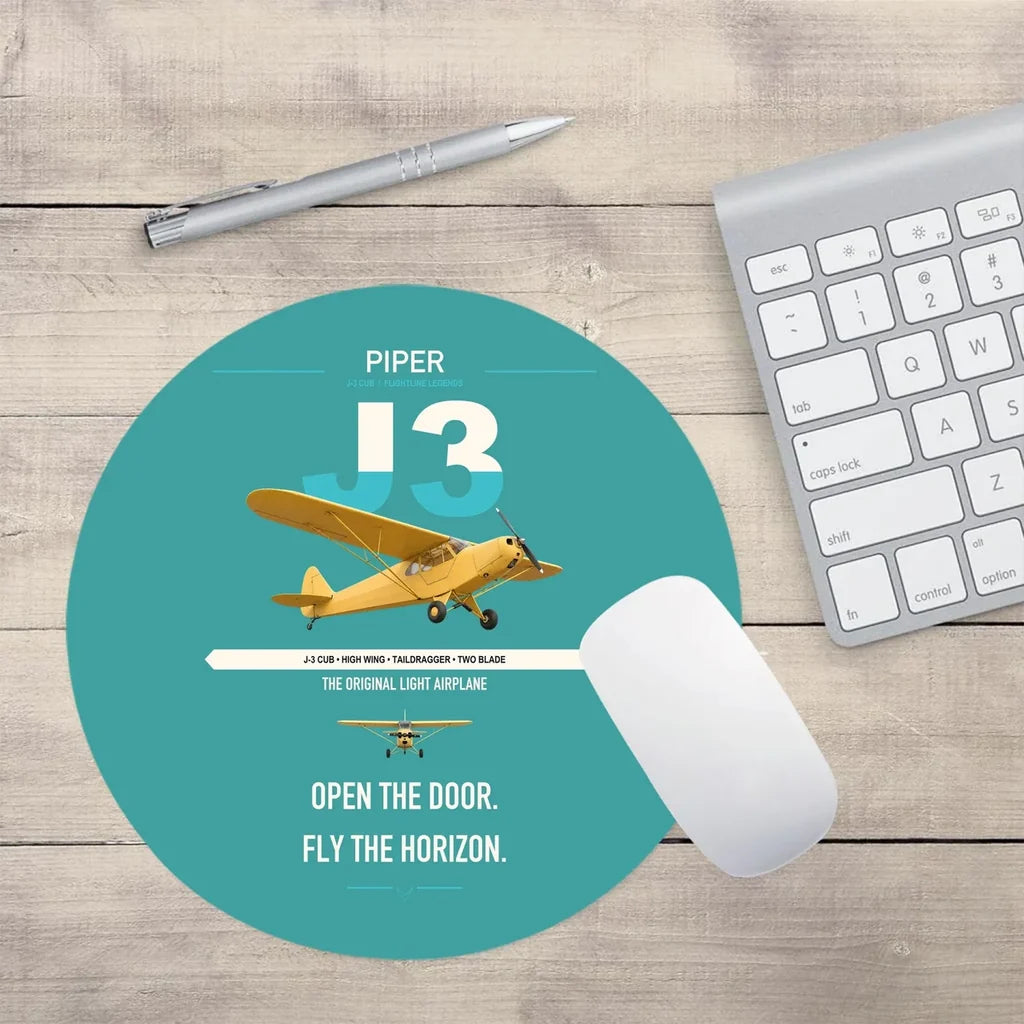 Piper J-3 Cub design on turquoise round mouse pad